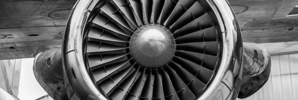 Detailed view of a jet engine in monochrome, showcasing aviation technology.